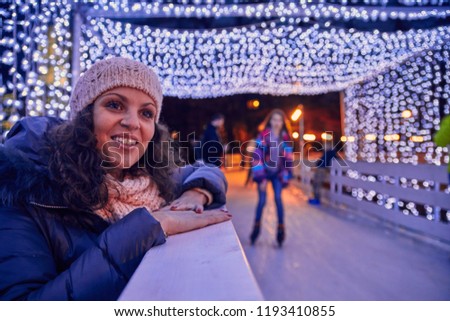 Woman Standing Beside Ice Rink