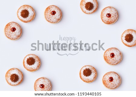 Jewish holiday Hanukkah sufganiyot on white background. Top view from above
