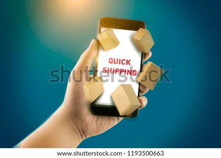 A hand holding a smartphone with boxes and the words Quick Shipping.