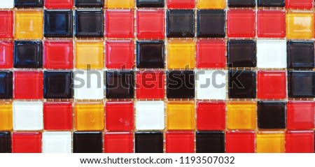 Close up colorful with Red, Orange, White and Black pattern of title floor or wall for background. Art wallpaper and Beautiful concept. 