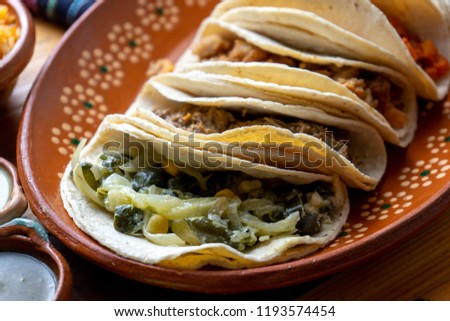 Traditional mexican stew tacos "guisados"