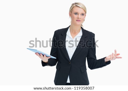 Businesswoman wondering while holding tablet and planning