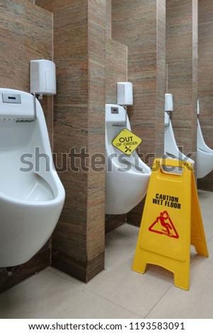 Sign board caution wet floor in the restroom