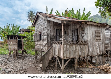 Village self built homes houses made from wood by villagers. Travel to Sao Tome and Principe. Beautiful paradise island in Gulf of Guinea. Former colony of Portugal. Royalty-Free Stock Photo #1193595163