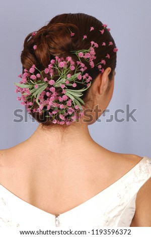 Beautiful bride hair with pink flowers