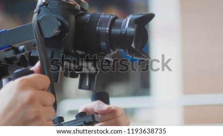 Operator with Steadicam recording video. professional photo video equipment