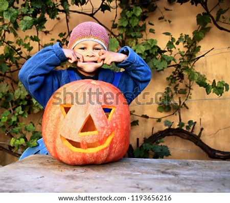 Little boy with a carved pumpkin reel people with background stock image and stock photo