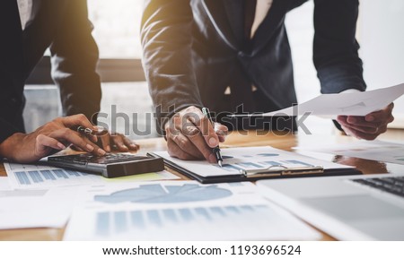 Business team meeting present, investor colleagues consultation and conference new strategy plan business and market growth on financial document graph report, Meeting and Talking.