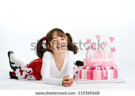 Little girl with pink birthday cake