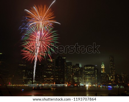 Diwali festival of lights fireworks on East River with Manhattan skyline behind