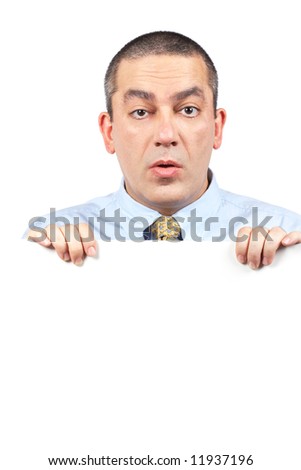 Surprised curious businessman behind the blank card