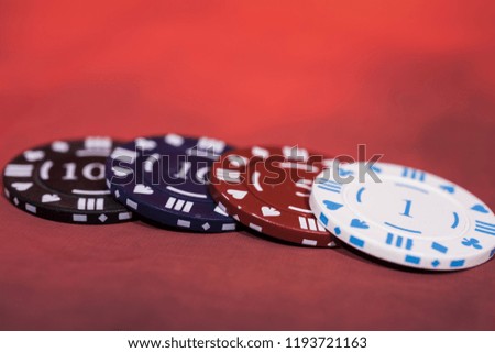 Casino abstract photo. Poker game on red background.  Theme of gambling. Royalty-Free Stock Photo #1193721163