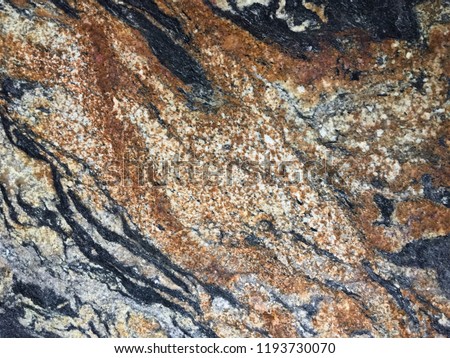 The floor is covered with exotic natural stone. Granite. Marble. Texture for interior design