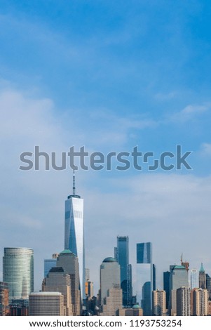 Skyline of Downtown Manhattan against Blue Sky