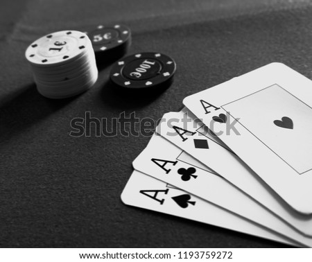 Close-up of aces poker on the table, black and white                               