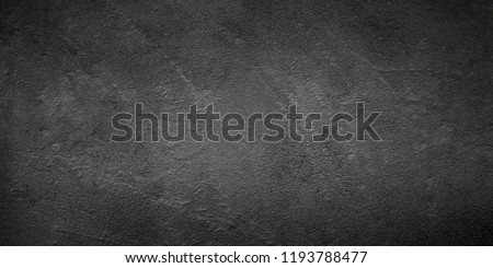 Abstract Grunge Black Stucco Wall Background. Monochrome Rough Surface Plaster Texture. Wide Angle gray Wallpaper Close up With Copy Space for design