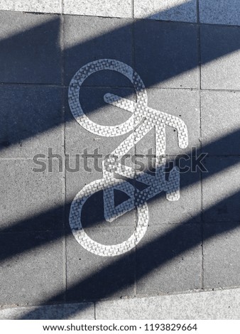 Bicycle path symbol on sidewalk