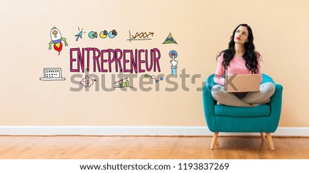 Entrepreneur with young woman using a laptop computer 