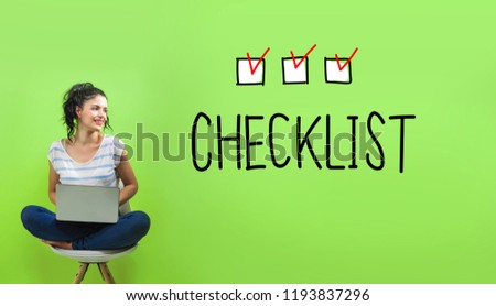 Checklist with young woman using a laptop computer 