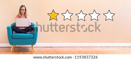One star rating with young woman using her laptop in a chair