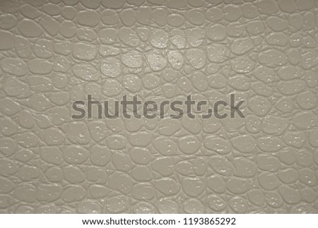 Genuine leather painted light reptile. Background. Texture. 
Close-up.
