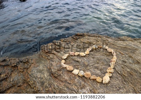 The stone is placed in the heart of the sea.