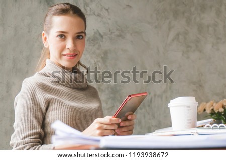 Freelance woman chatting with customer in café via tablet
