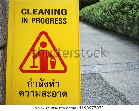 Clean Warning Sign, Caution on Floor, "Kamlang Thum Kwam Sa axad" is Thai Language...