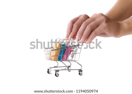 online shopping e-commerce sale and delivery service concept, discounts, black Friday, sale: shopping cart multicolored packages and boxes with trolleybus logo on white background,