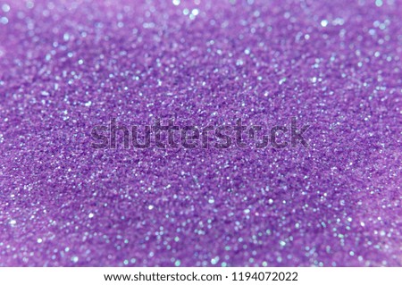 Glitter background in purple, violet and blue colors. Festive background. Small size particles. Magic glowing effect. Perfect for festive invitation, phone wallpaper or greeting card.