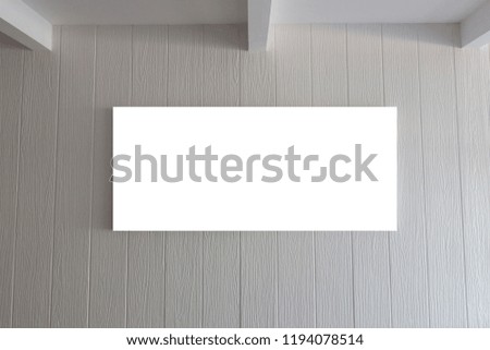 Blank frame on vintage white wooden wall