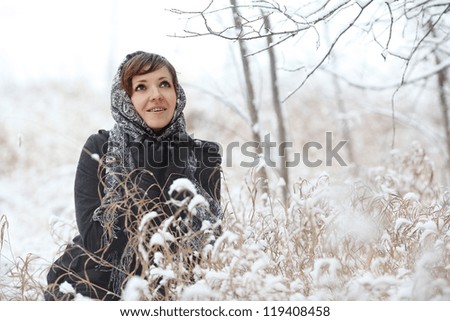 young woman in a winter forest with snow Christmas