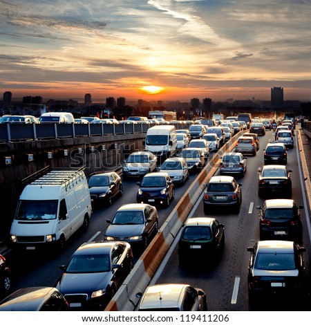 Late afternoon traffic. Traffic jam. Cars. Urban scene. Royalty-Free Stock Photo #119411206