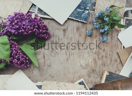 Lilac flowers on a vintage background with old photo/toned photo