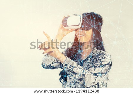 Girl with Smartphone using VR Box google 3D Virtual Reality Glasses headset , Asian woman with Modern imaging Future technology.simulation training with the Ai hologram,internet of things(iot) concept