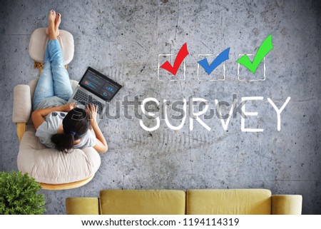Freelancer working from home taking an online survey 
                            