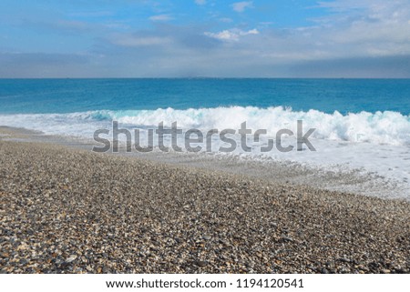 Natural splashing wave sea stone beach on sunny day at HUALIEN TAIWAN.