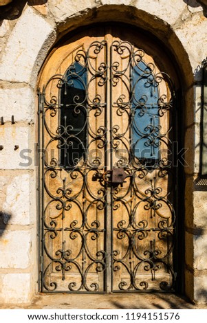 Locked old door in the picturesque medieval city of Eze Village in the South of France.