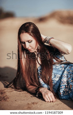 close up of attractive young woman wearing boho accessories.