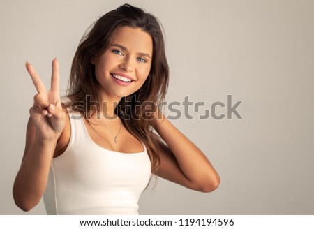 girl is happy and shows the gesture
