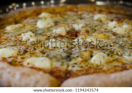 Pizza four cheeses (close-up)