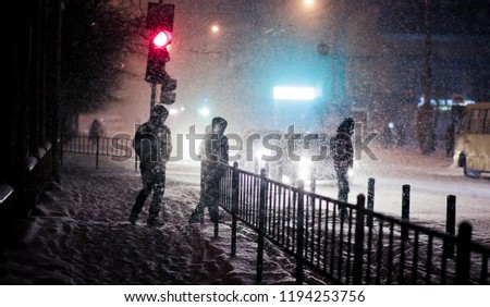 people are snowy in the evening