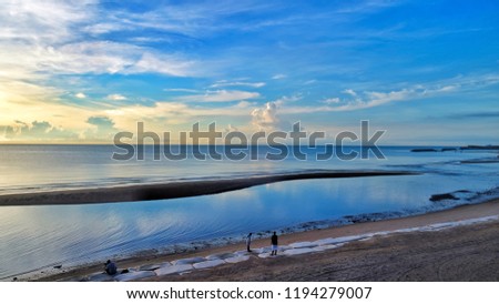 High angle beach photo during sunrise.