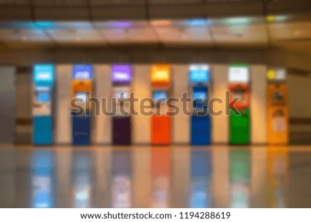 blured image of Colorful ATM money machine in train station