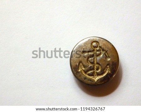 Sailor button with an anchor. 