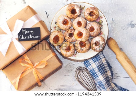 Oriental Algerian sweet cookies with apricot jam peanuts and gift boxes, merry christmas concept