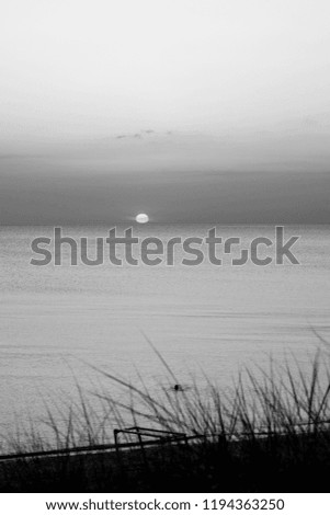 Beautiful sunset at the sea. Black and white photography