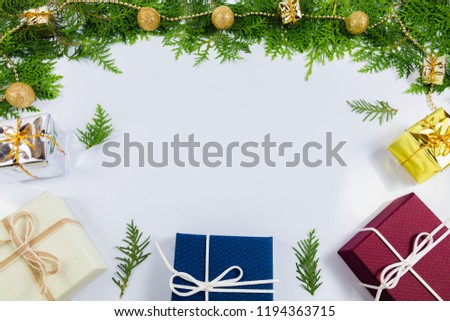 Pine leaf and gift box, white background