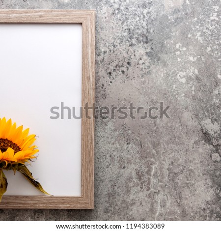 Half frame with sunflower on a concrete background vintage concrete wall