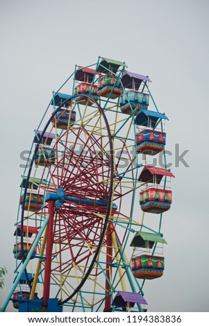 A large tall whirligigs in an amusement park unique photo